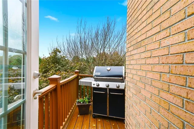 a living room with furniture a large window and a chandelier