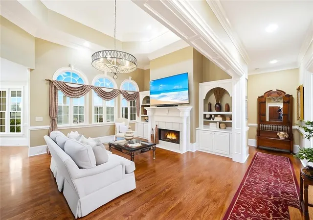 a bathroom with a granite countertop sink a mirror and a bathtub