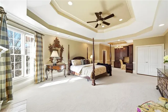 a bedroom with furniture and a window