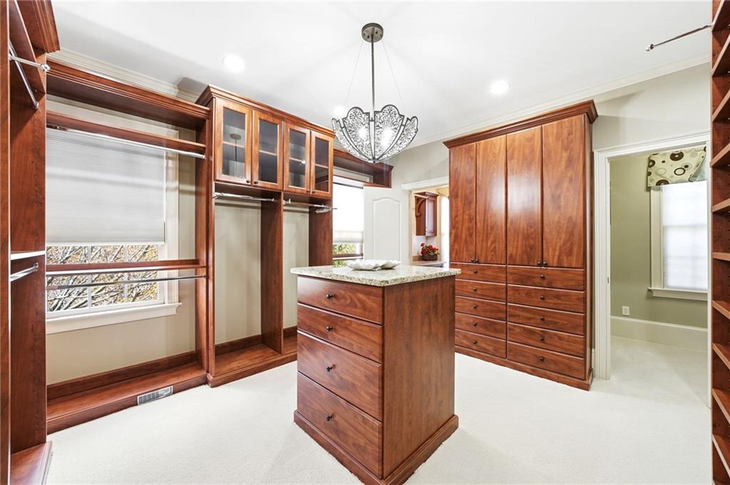 2855 Strathmore Drive Cumming, GA 30041 - Photo 37 of 96 a kitchen with stainless steel appliances granite countertop a refrigerator and cabinets