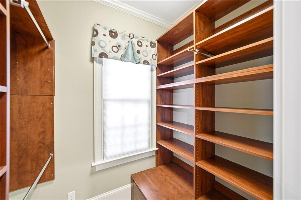 2855 Strathmore Drive Cumming, GA 30041 - Photo 38 of 96 a view of walk in closet with empty racks