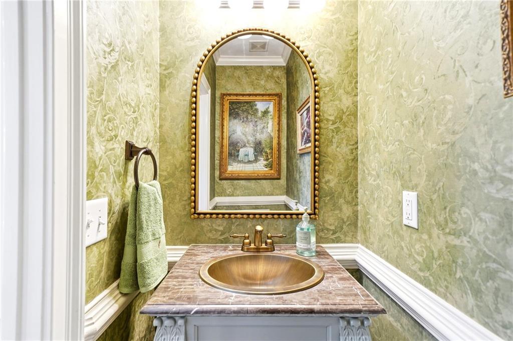 2855 Strathmore Drive Cumming, GA 30041 - Photo 45 of 96 a bathroom with a granite countertop sink a mirror and a bathtub