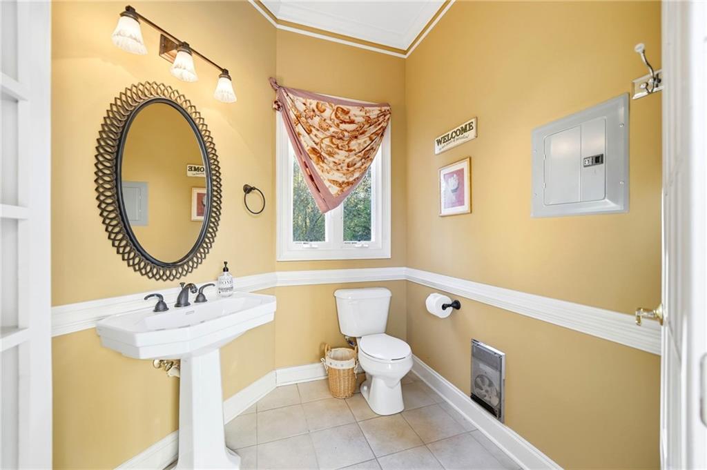 2855 Strathmore Drive Cumming, GA 30041 - Photo 80 of 96 a bathroom with a toilet sink and mirror