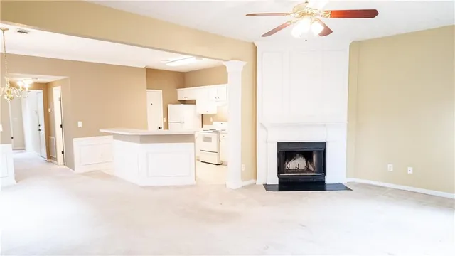 a view of a kitchen with a sink and a fireplace