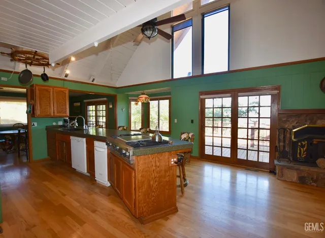 a kitchen with stainless steel appliances granite countertop a stove and a refrigerator