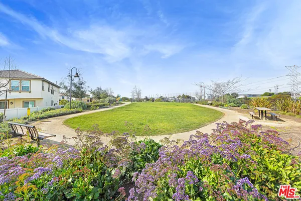 a view of a swimming pool with a yard