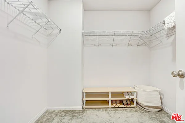 a view of a room with racks on the wall