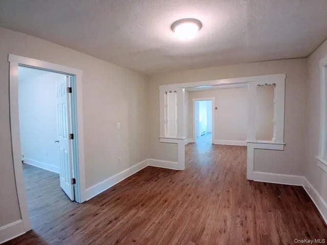 wooden floor & wooden door in an empty room