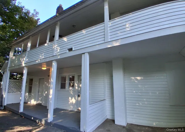 a kitchen with wooden floors and white appliances