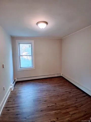 a view of an empty room with windows