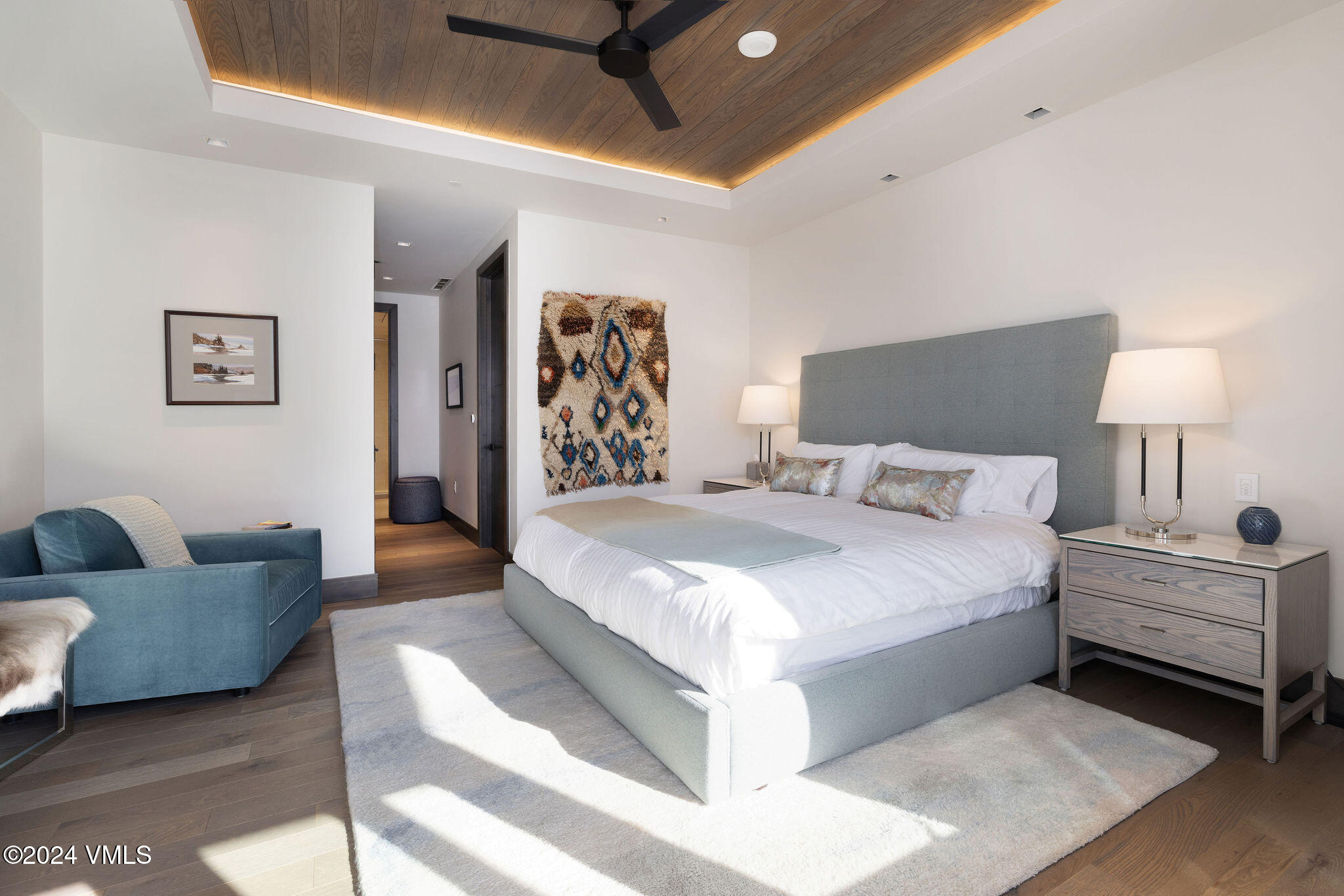 430 South Frontage Road East, Unit RU301 Vail, CO 81657 - Photo 11 of 29 a spacious bedroom with a bed and a couch