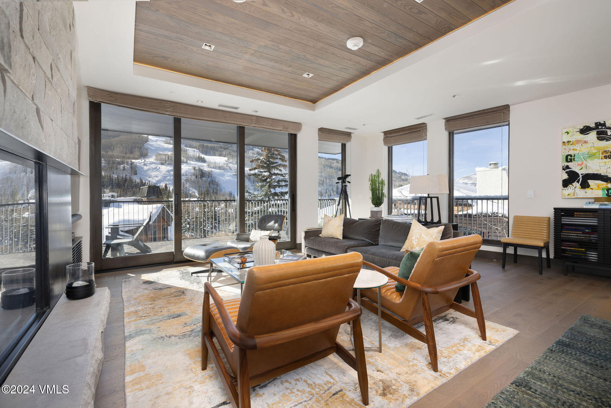 430 South Frontage Road East, Unit RU301 Vail, CO 81657 - Photo 2 of 29 a living room with furniture and a floor to ceiling window