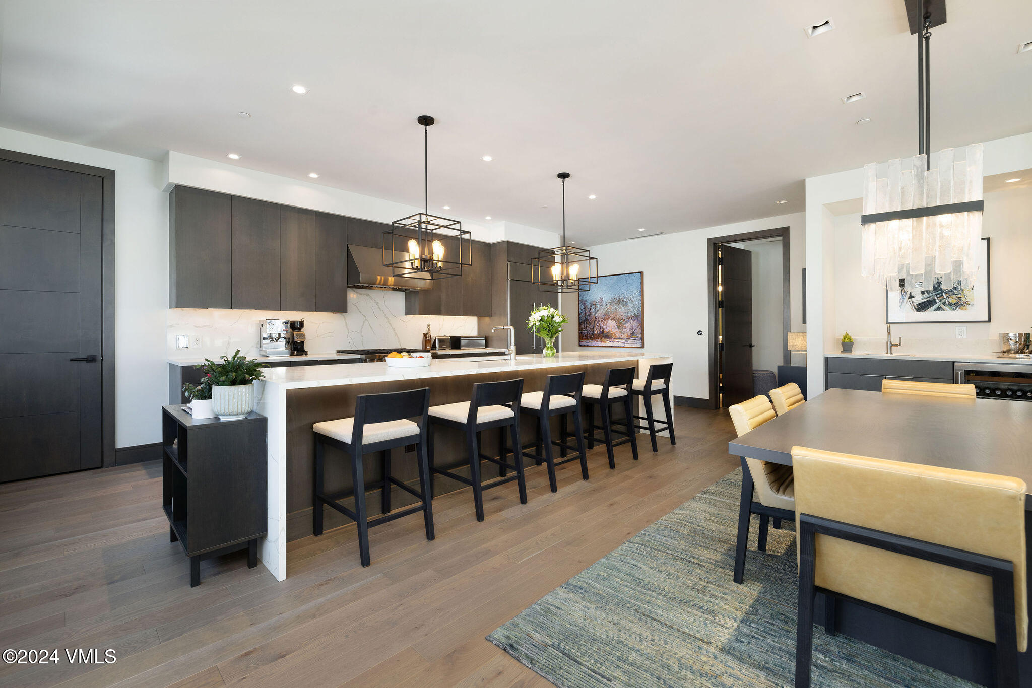 430 South Frontage Road East, Unit RU301 Vail, CO 81657 - Photo 9 of 29 a large kitchen with a table and chairs