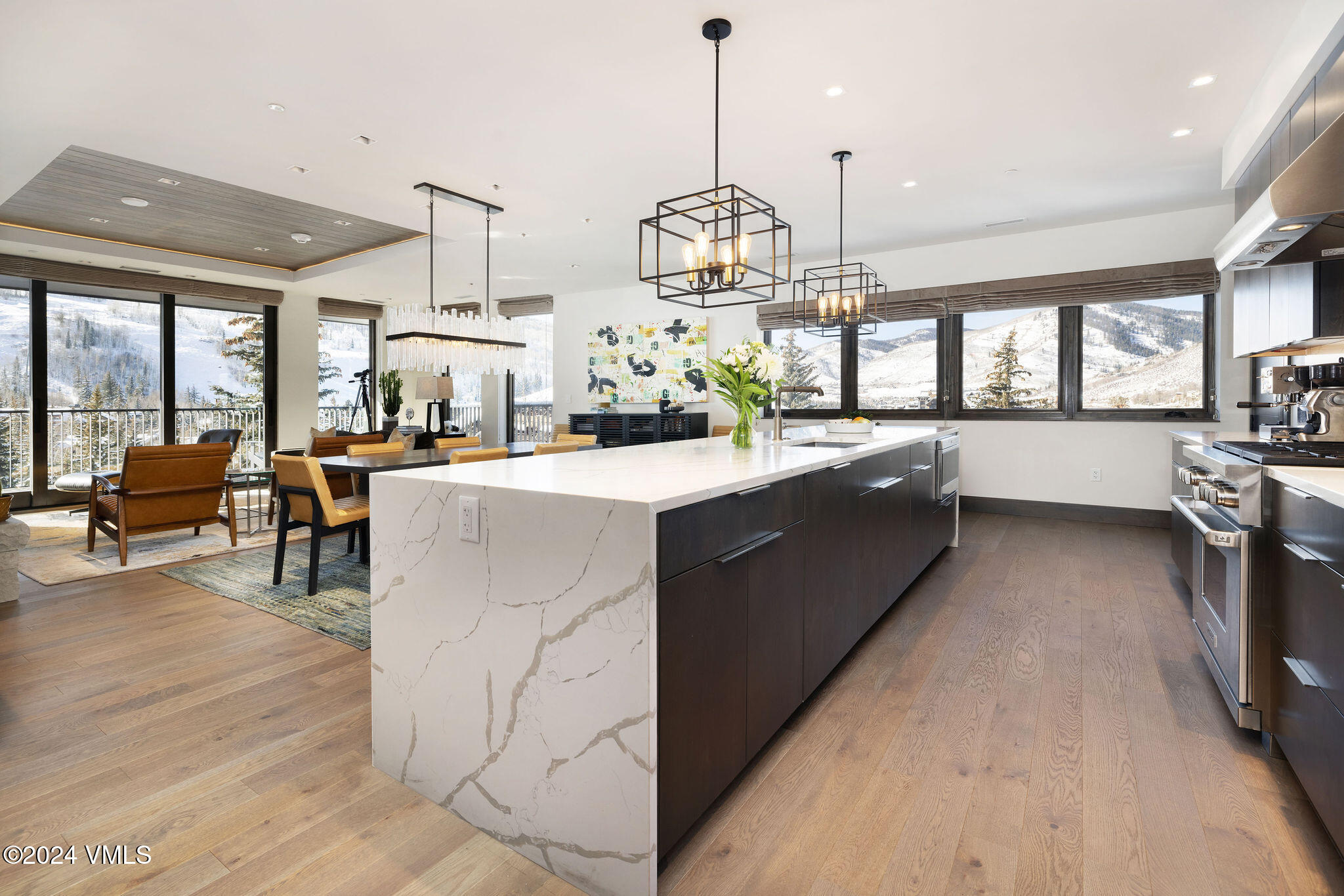 430 South Frontage Road East, Unit RU301 Vail, CO 81657 - Photo 10 of 29 a kitchen with stainless steel appliances kitchen island granite countertop lots of counter top space