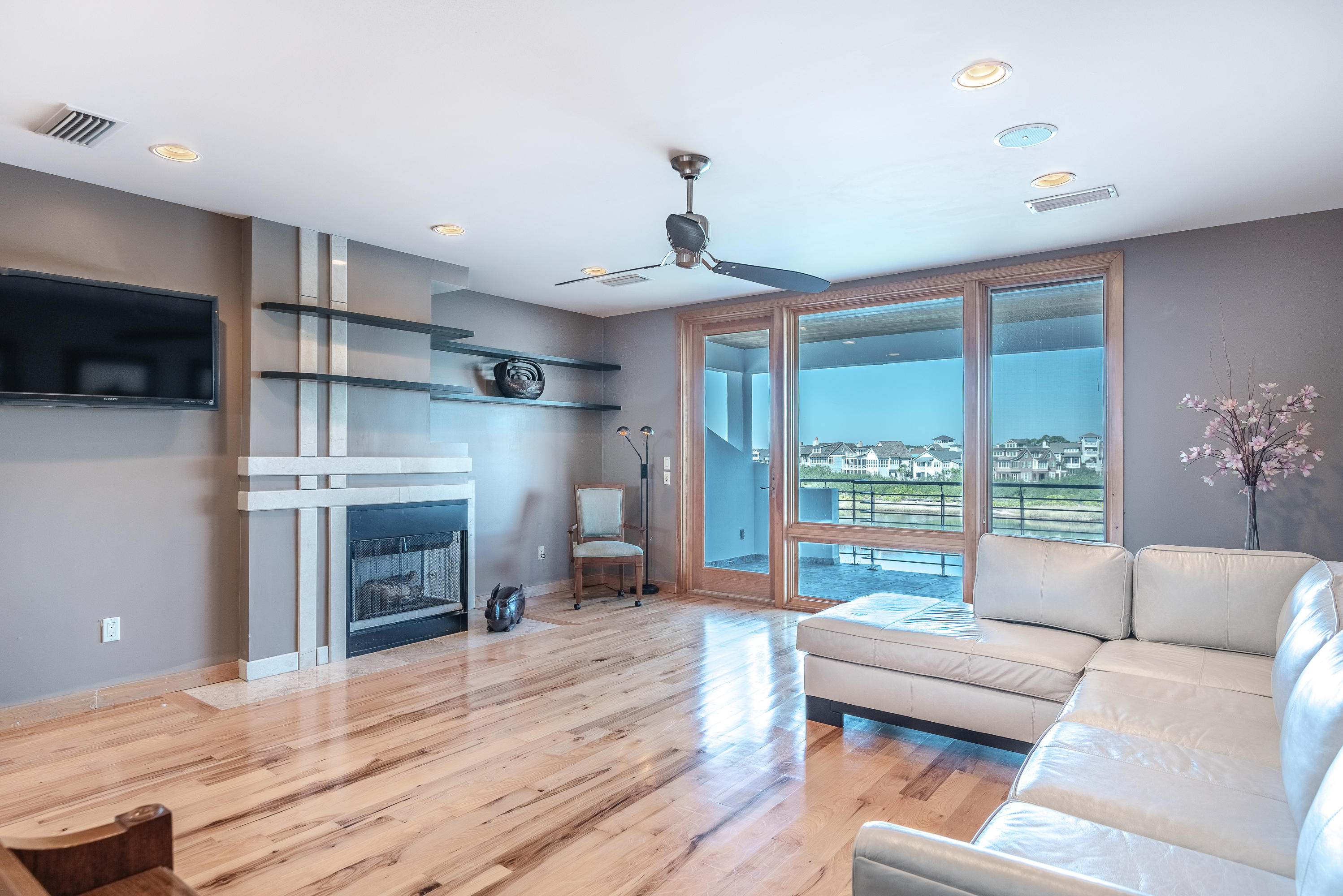 52 Camp Creek Point Inlet Beach, FL 32461 - Photo 27 of 74 a living room with furniture a flat screen tv and a fireplace