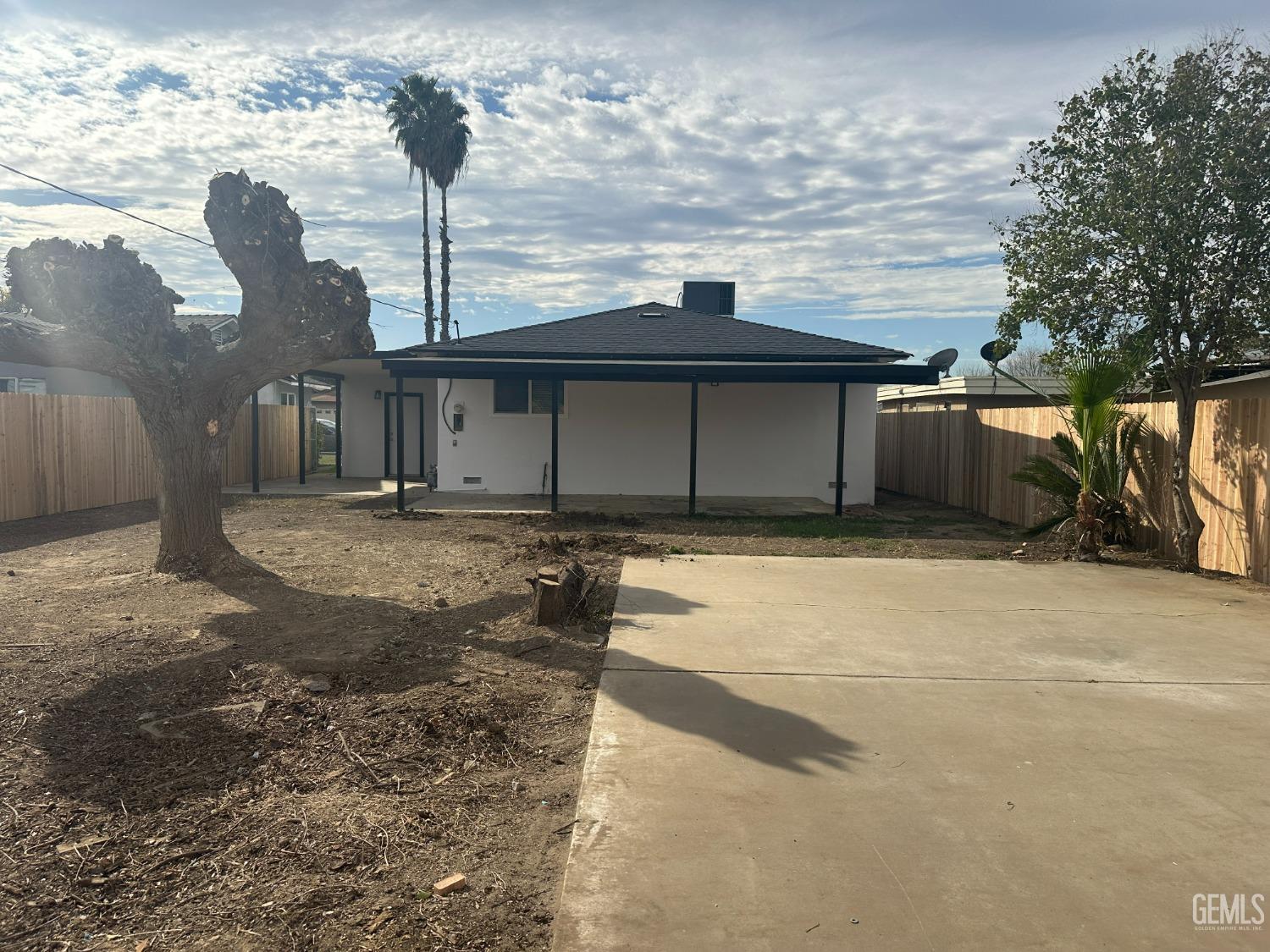 Undisclosed Address Shafter, CA 93263 - Photo 18 of 21 a front view of a house with a yard and garage