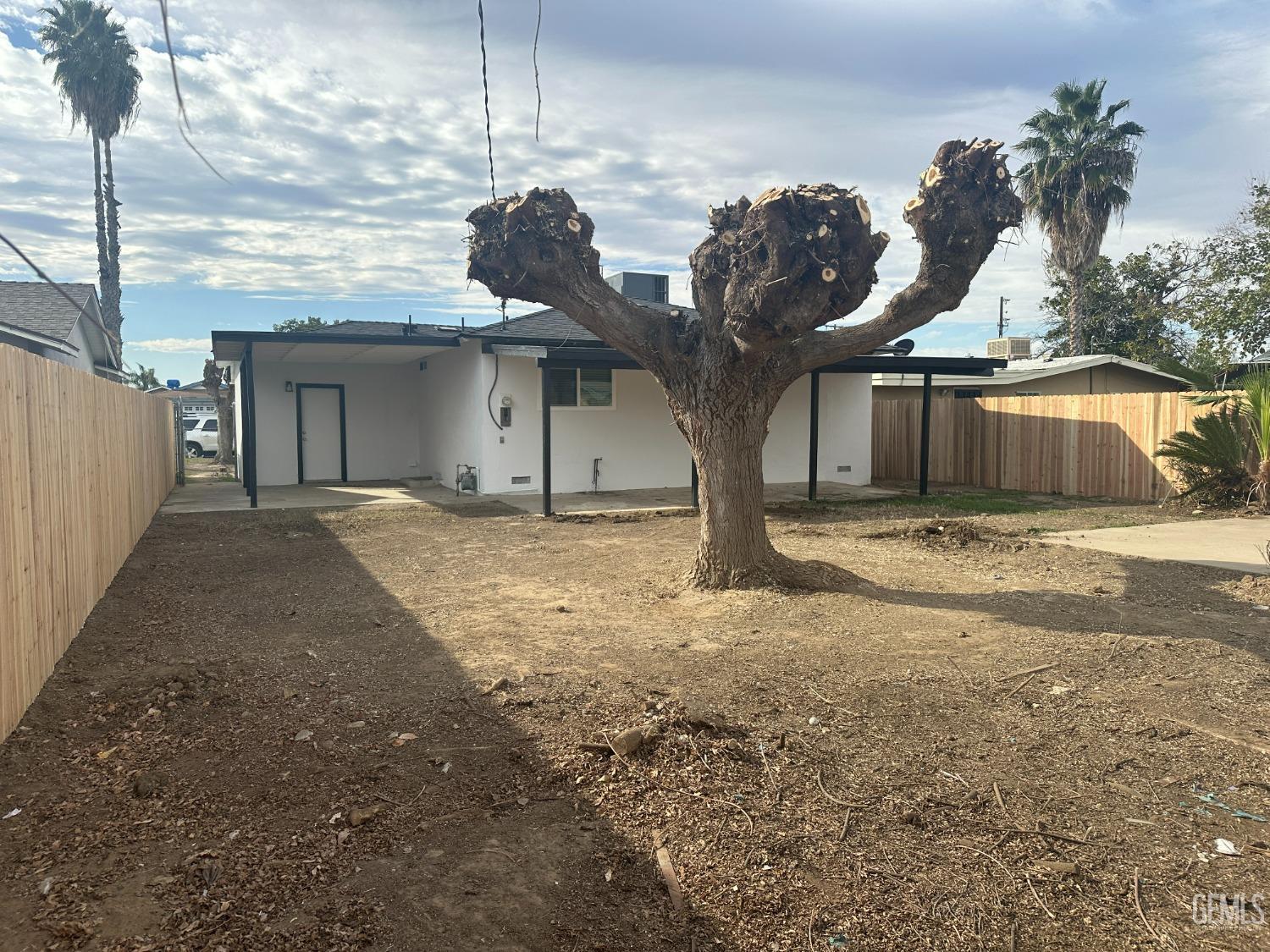 Undisclosed Address Shafter, CA 93263 - Photo 19 of 21 a view of a house with a backyard