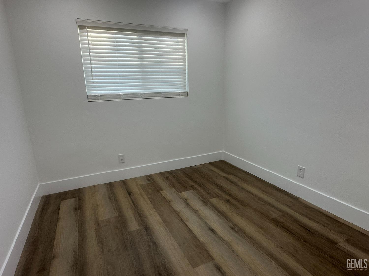Undisclosed Address Shafter, CA 93263 - Photo 9 of 21 a view of wooden floor in a room