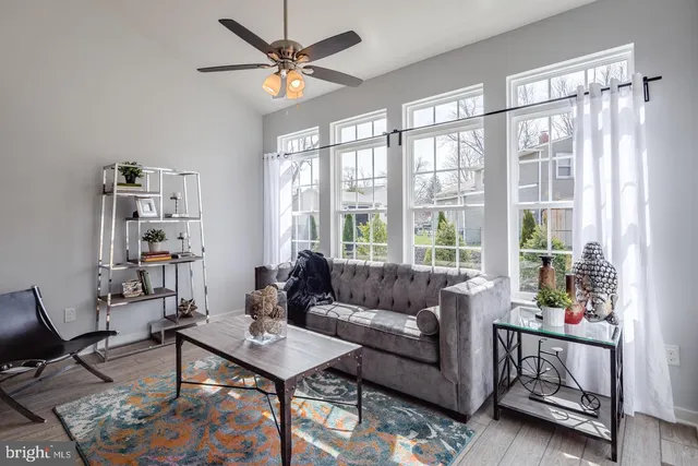 a living room with furniture and a window