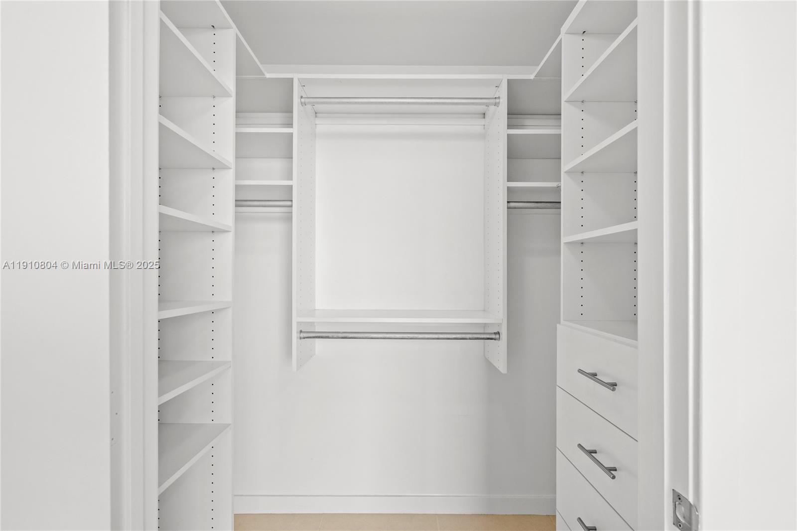 1111 Southwest 1st Avenue, Unit 2414N Miami, FL 33130 - Photo 18 of 49 a view of walk in closet with empty racks