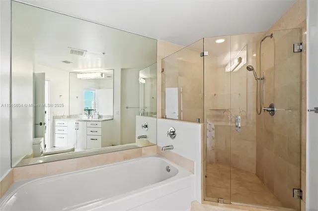 a bathroom with a bathtub shower sink and toilet