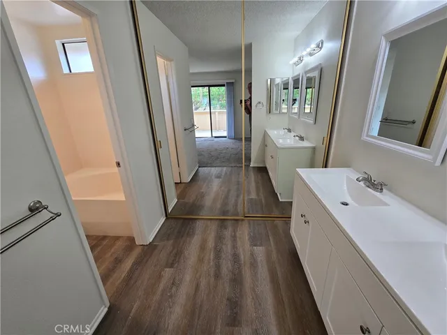 a view of a back yard of the house with green space