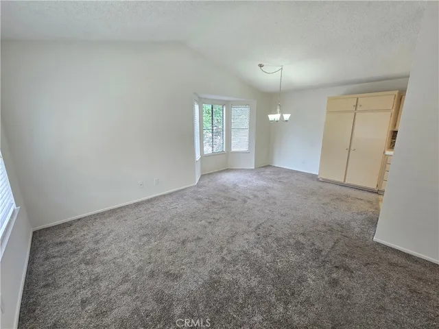 a kitchen with sink stove and cabinets
