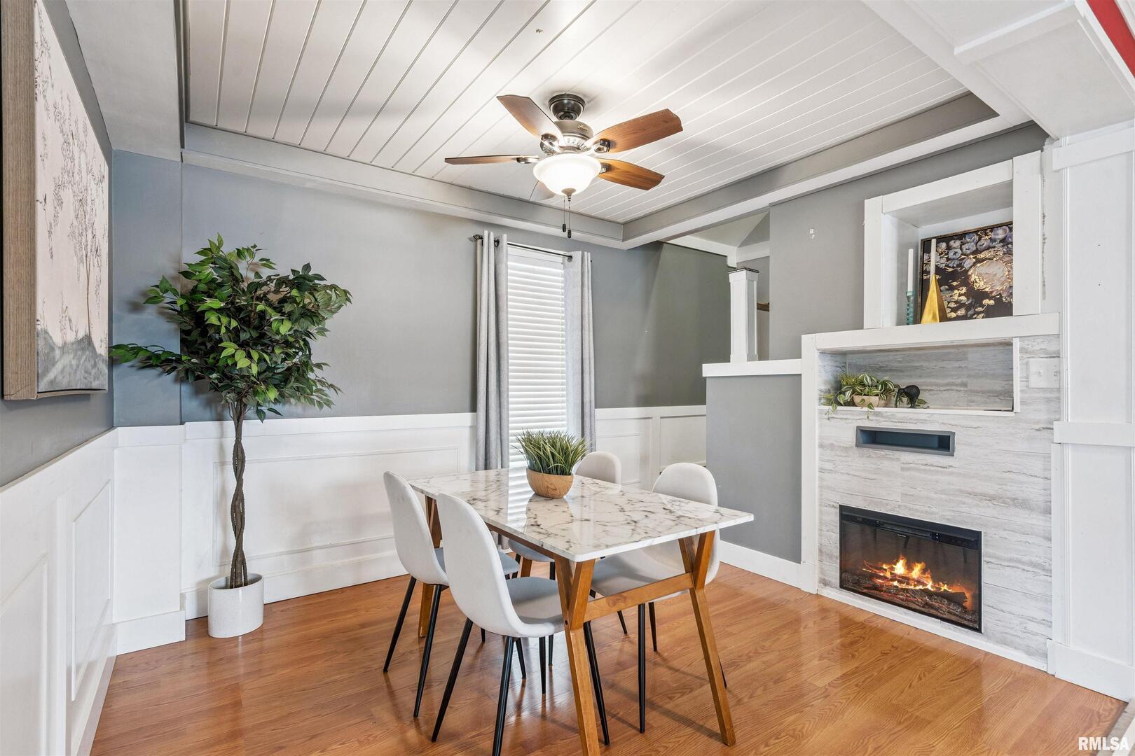 126 South Genessee Street Blue Grass, IA 52726 - Photo 2 of 22 a view of a livingroom with furniture and a fireplace
