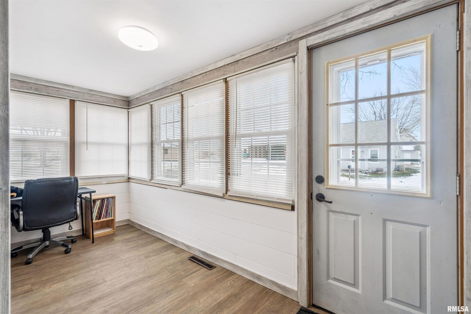 126 South Genessee Street Blue Grass, IA 52726 - Photo 9 of 22 a view of workspace with furniture and windows