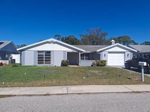 a view of a house with a yard