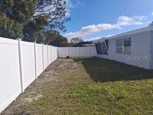 a view of a backyard of the house