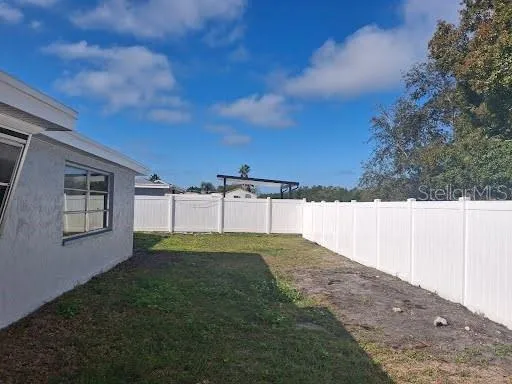 a view of backyard with green space