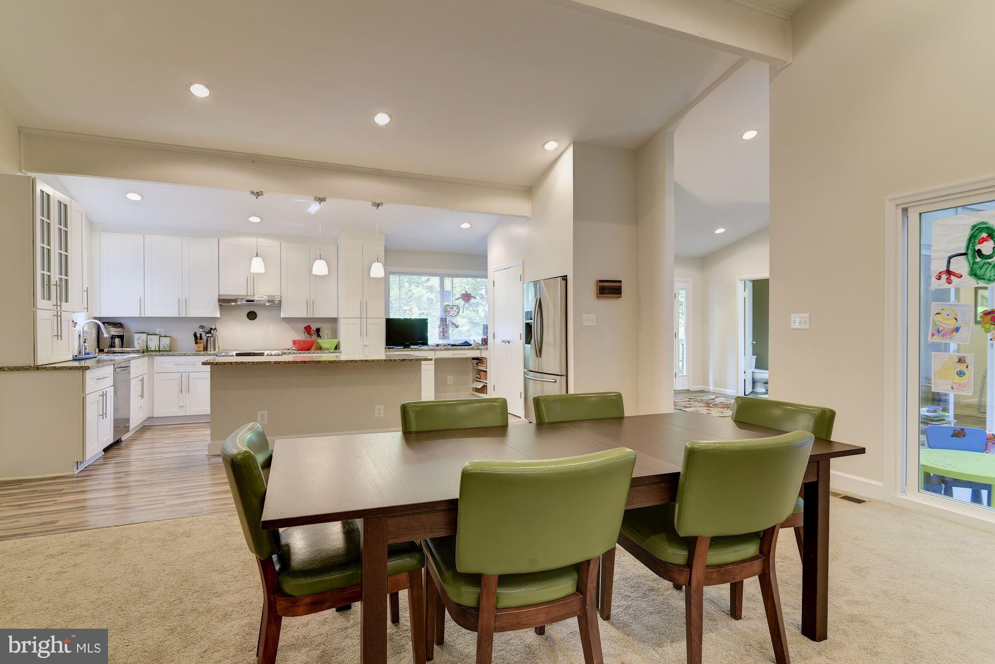 7608 Hamilton Spring Road Bethesda, MD 20817 - Photo 11 of 21 a dining room with furniture and a view of kitchen