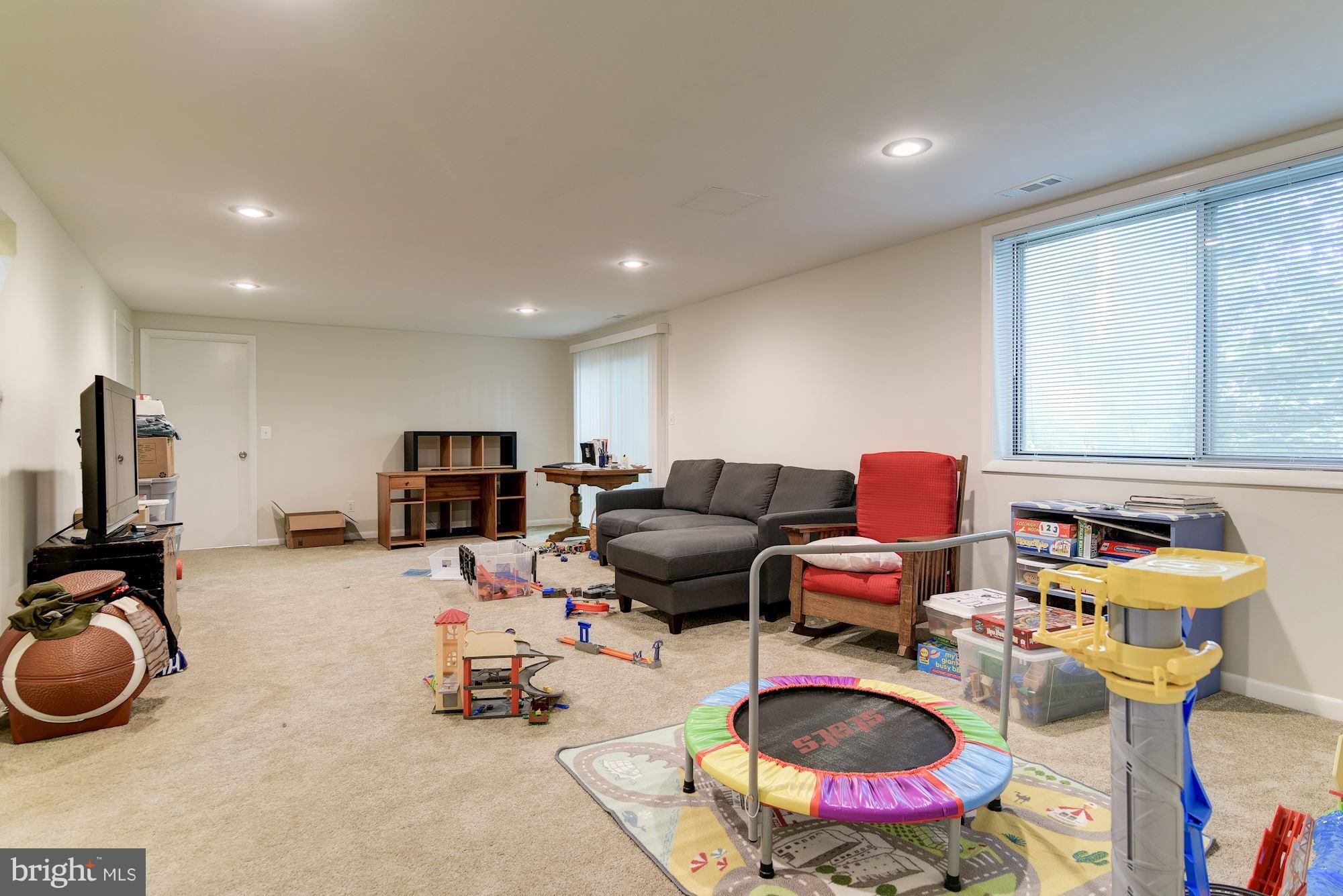 7608 Hamilton Spring Road Bethesda, MD 20817 - Photo 17 of 21 a room with furniture and a wooden floor