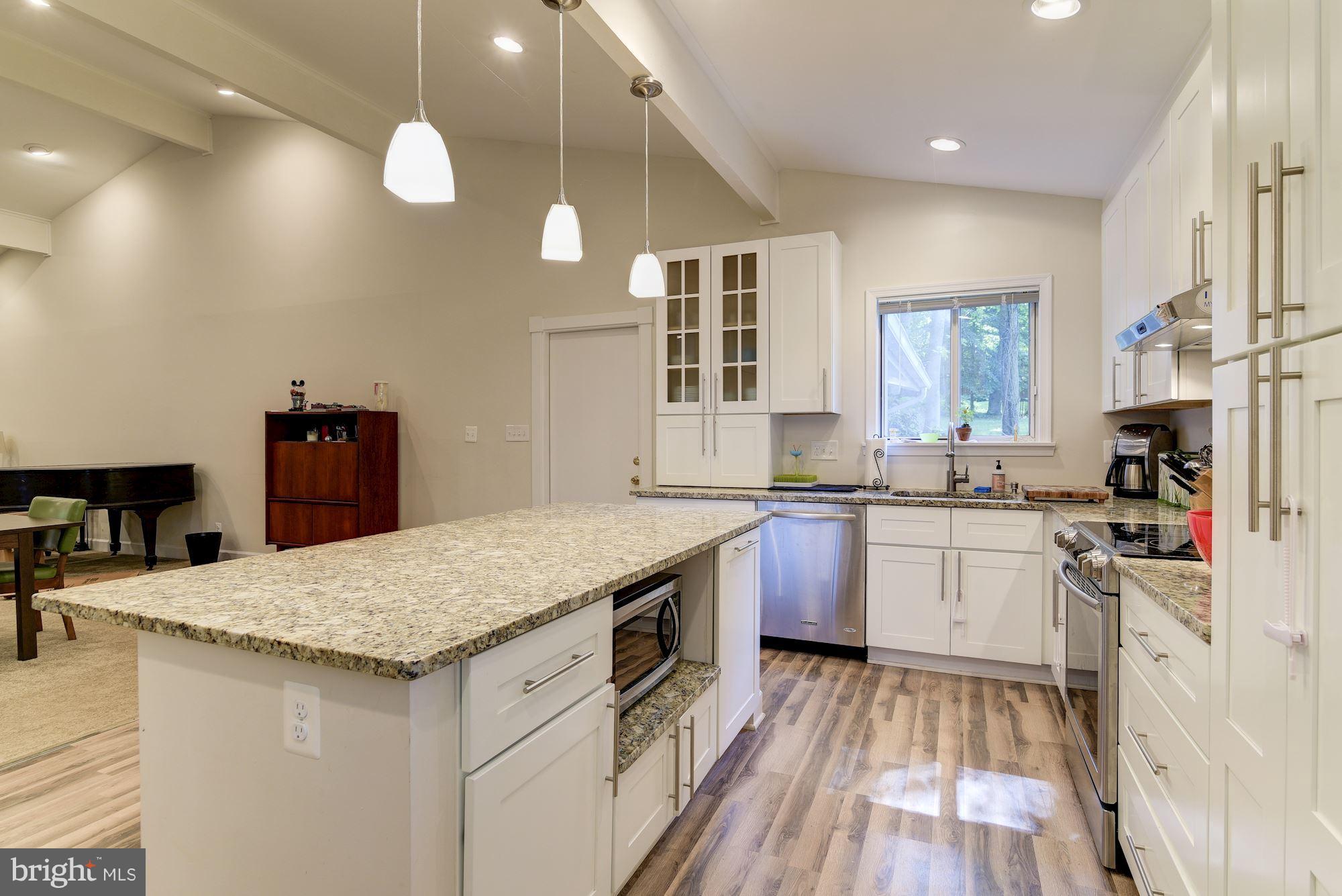 7608 Hamilton Spring Road Bethesda, MD 20817 - Photo 3 of 21 a kitchen with a sink stove and refrigerator