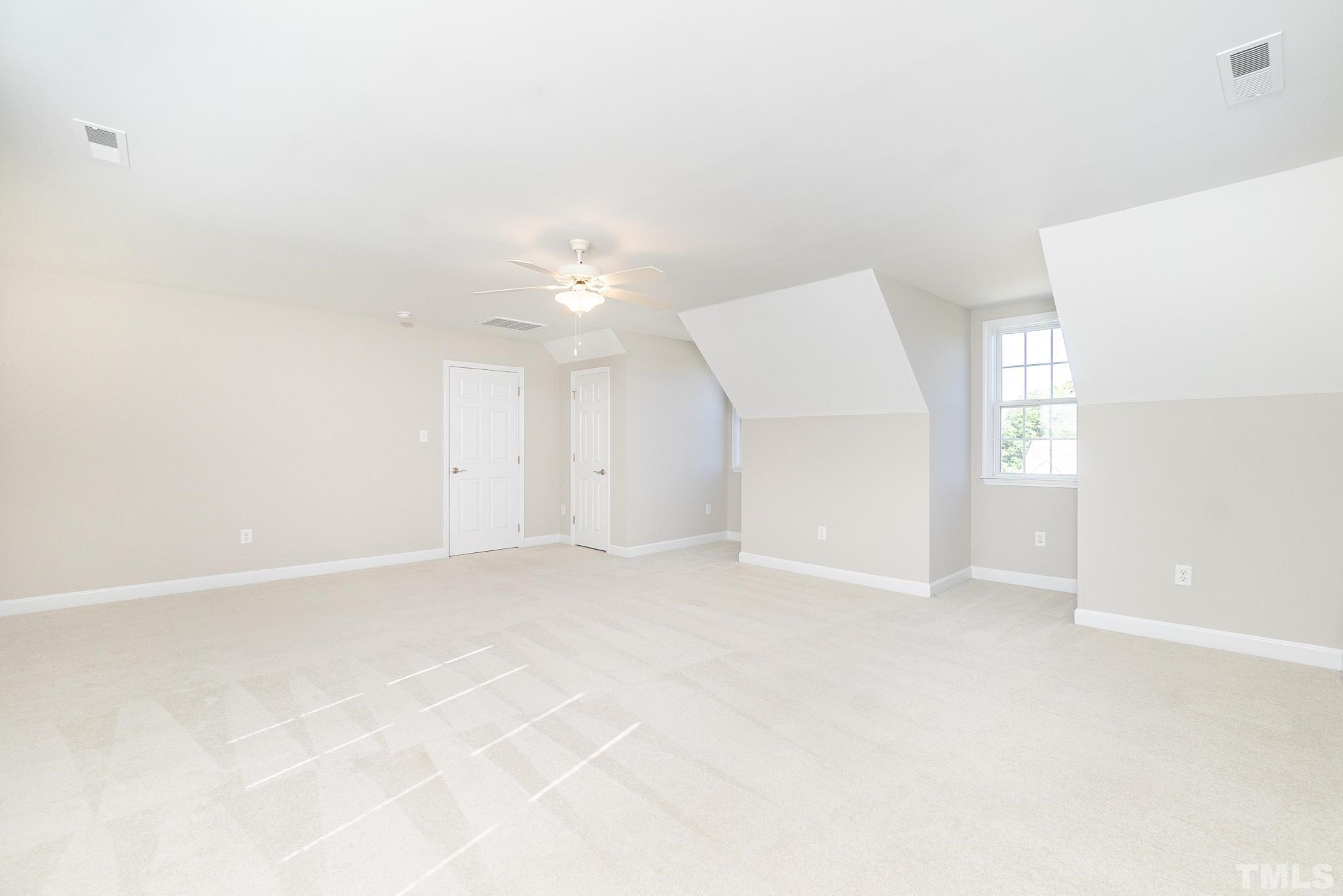 4812 Elmhurst Ridge Court Raleigh, NC 27616 - Photo 14 of 23 an empty room with windows and entrance