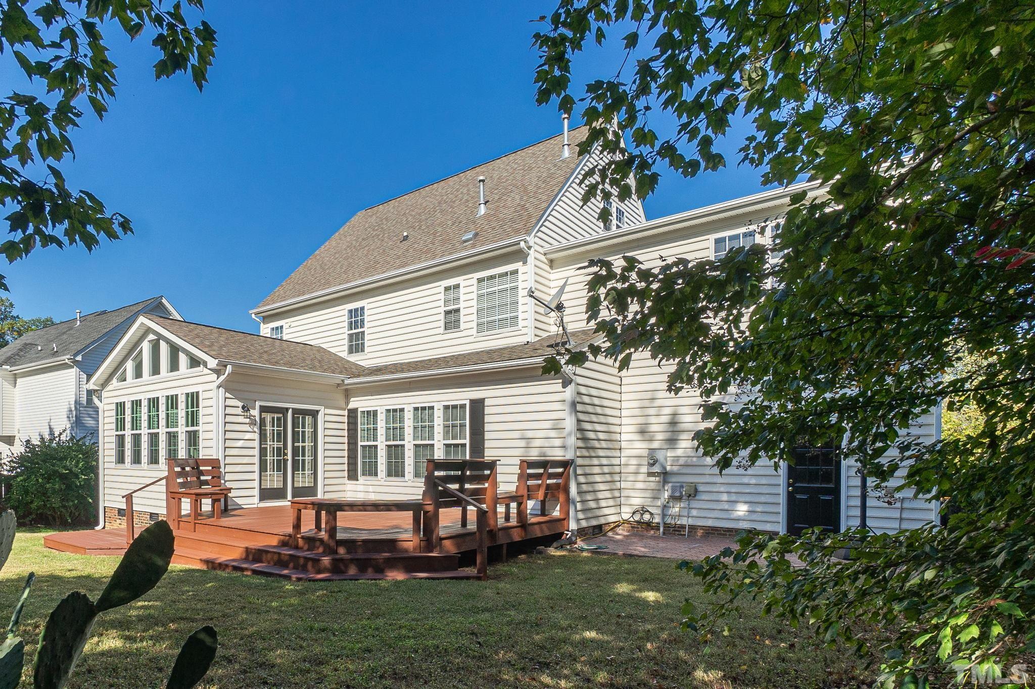 4812 Elmhurst Ridge Court Raleigh, NC 27616 - Photo 20 of 23 a front view of a house with a garden