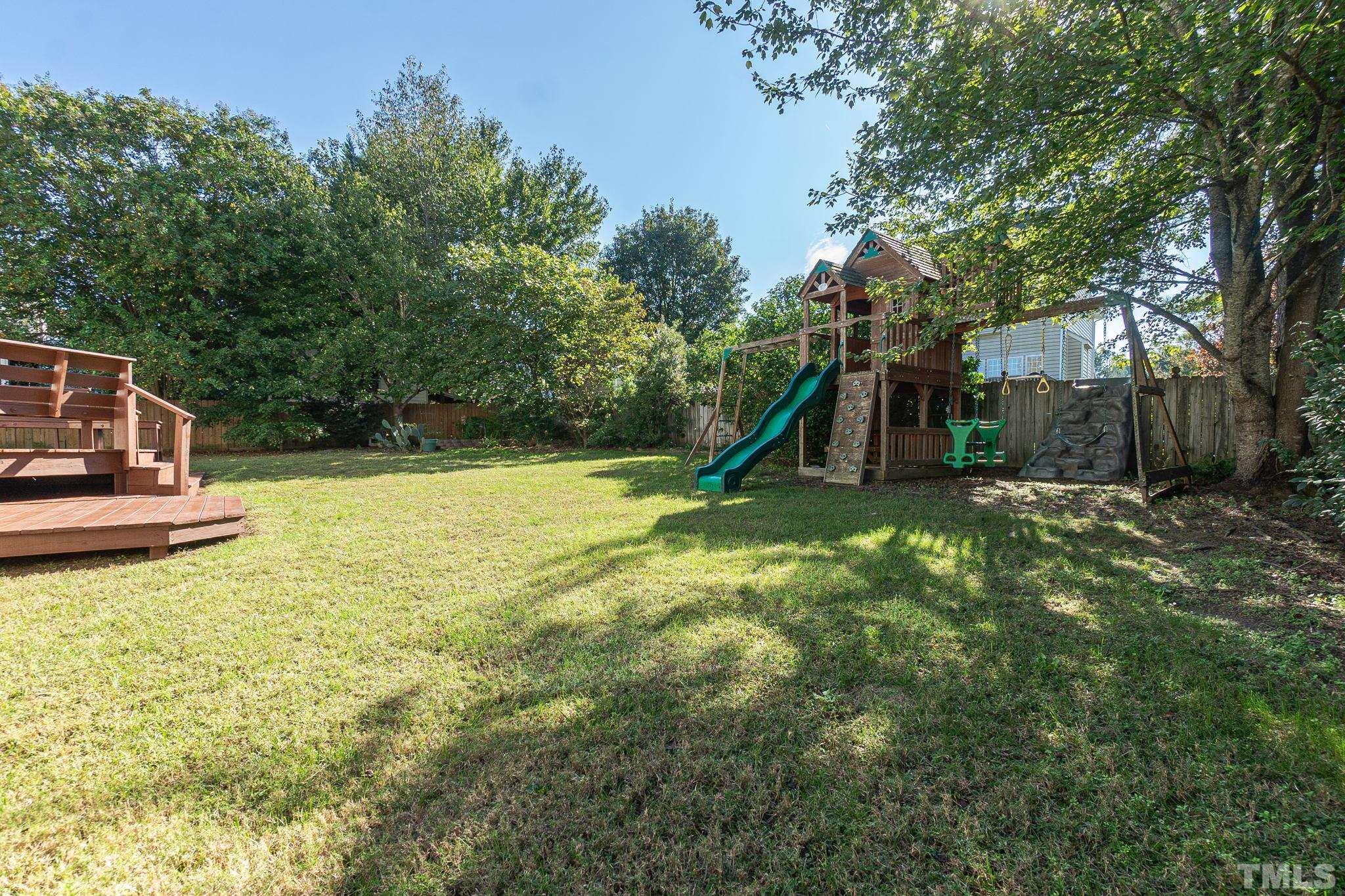4812 Elmhurst Ridge Court Raleigh, NC 27616 - Photo 23 of 23 a view of a garden with a small house