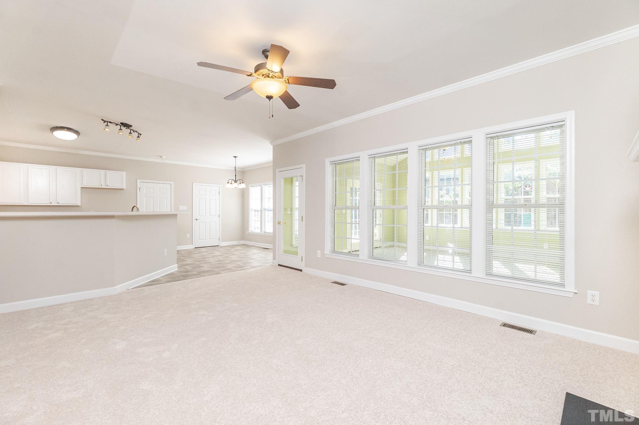 4812 Elmhurst Ridge Court Raleigh, NC 27616 - Photo 6 of 23 a view of an empty room with a window