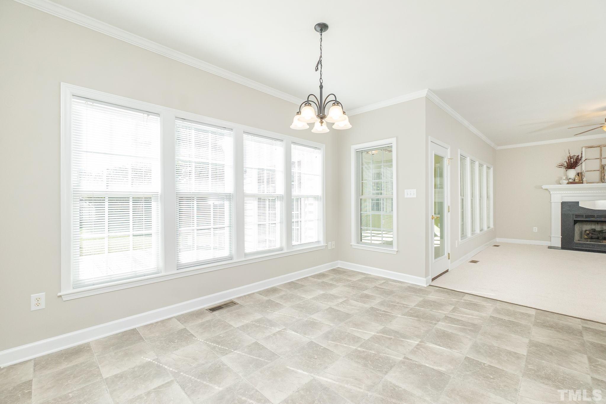 4812 Elmhurst Ridge Court Raleigh, NC 27616 - Photo 8 of 23 a view of an empty room with a window