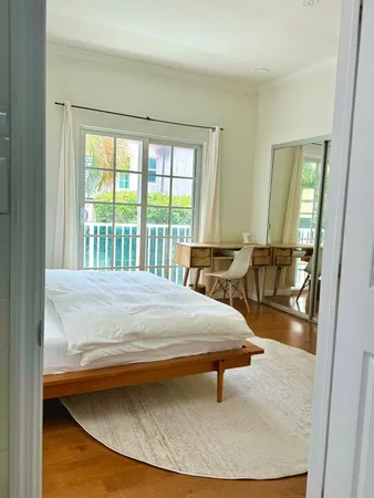 a dining room with table and chairs