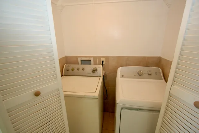a utility room with dryer and washer