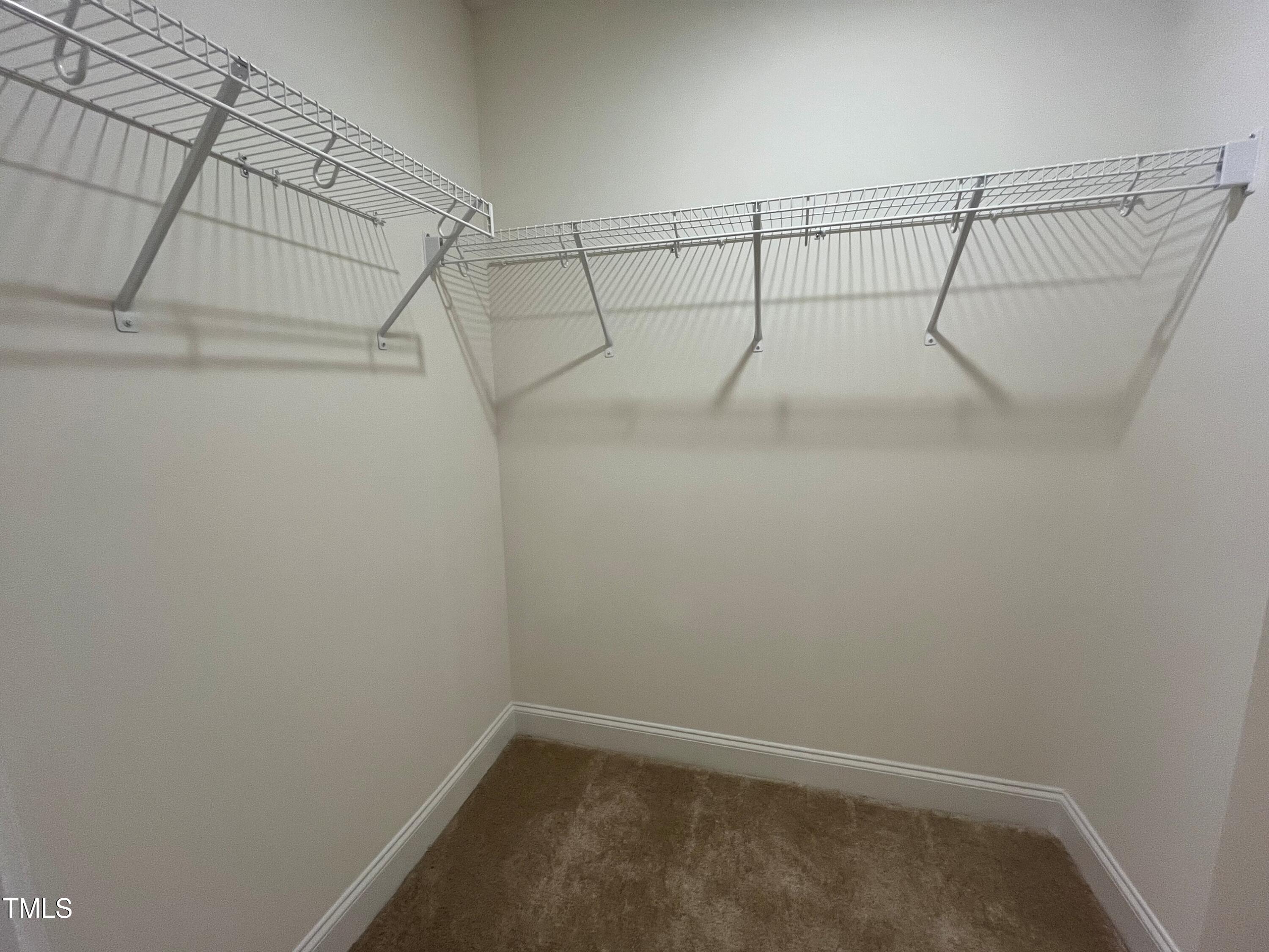 5208 Ranger Grv Way Raleigh, NC 27604 - Photo 34 of 59 a view of a room with racks on the wall