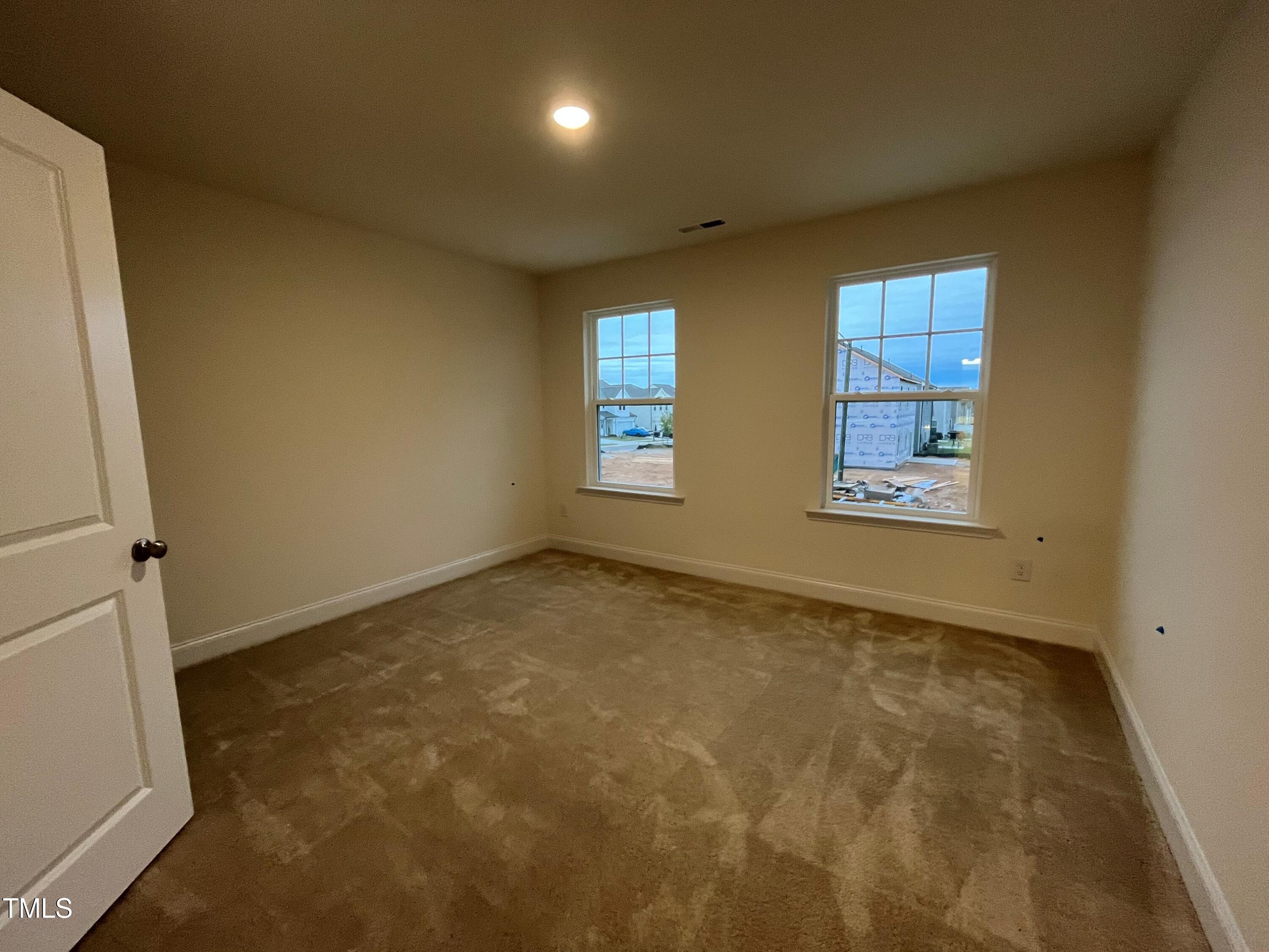 5208 Ranger Grv Way Raleigh, NC 27604 - Photo 41 of 59 an empty room with windows