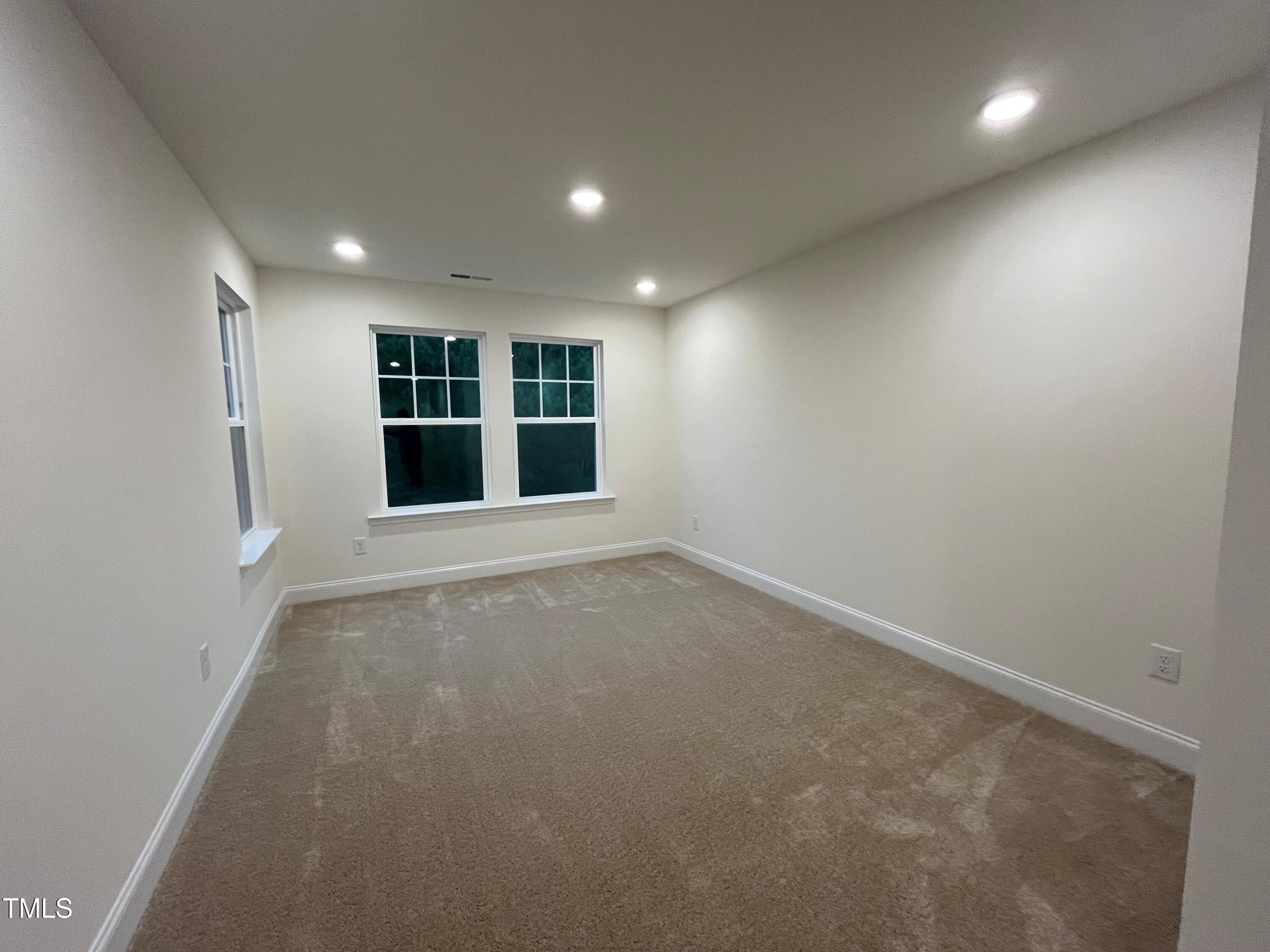 5208 Ranger Grv Way Raleigh, NC 27604 - Photo 42 of 59 a view of an empty room with a window