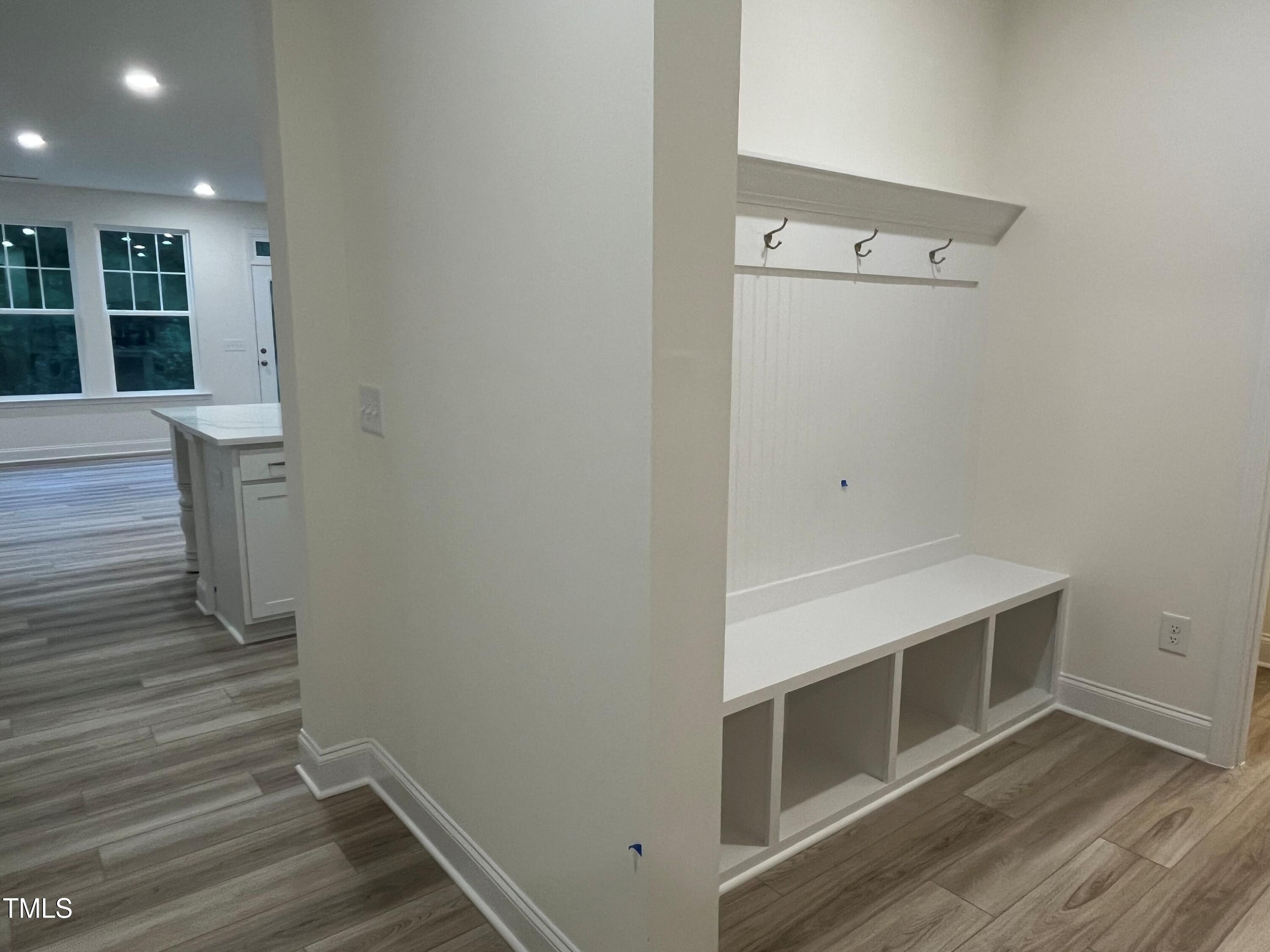 5208 Ranger Grv Way Raleigh, NC 27604 - Photo 10 of 59 a view of an empty room with wooden floor and a window