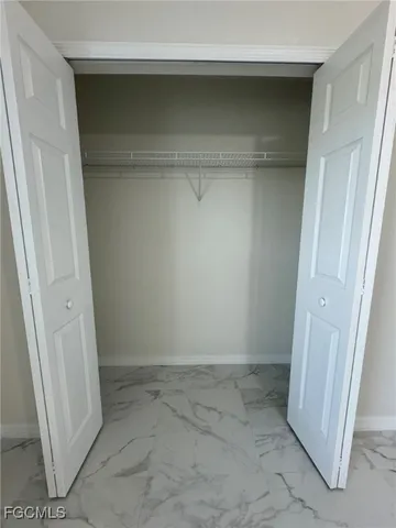 a bathroom with a toilet sink and shower