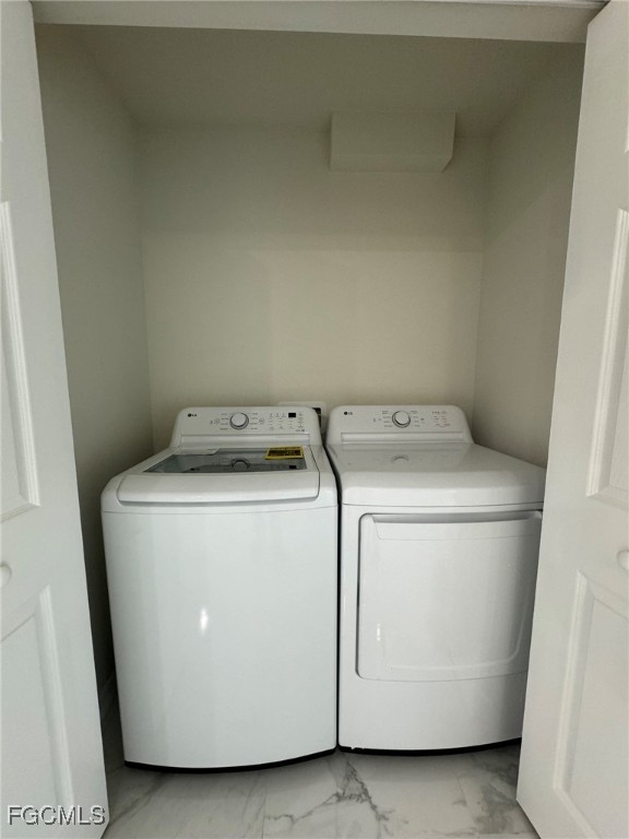 884 Alabama Road South Lehigh Acres, FL 33974 - Photo 31 of 37 a utility room with dryer and washer