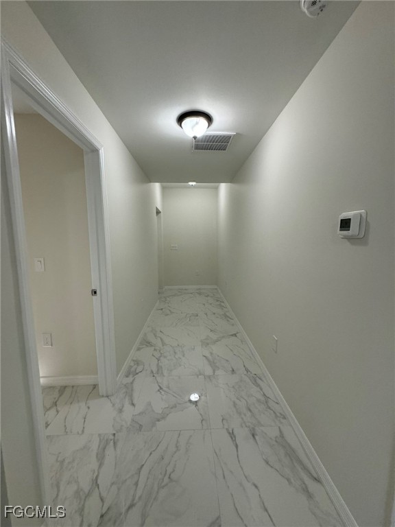 884 Alabama Road South Lehigh Acres, FL 33974 - Photo 32 of 37 wooden floor in an empty room