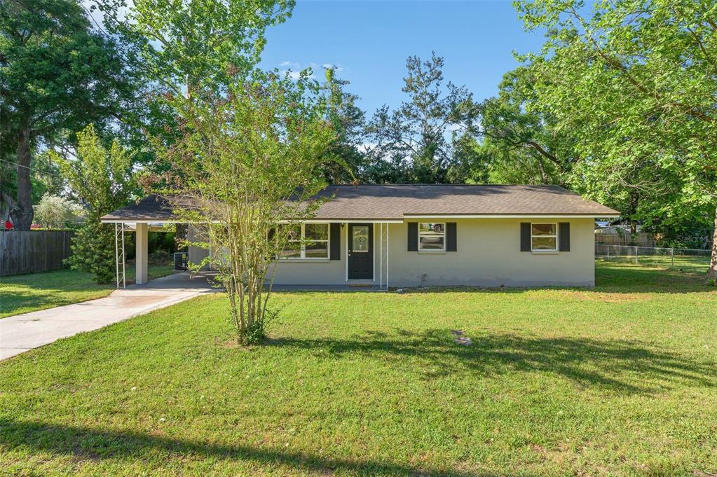 26443 Southwest 3rd Place Newberry, FL 32669 - Photo 1 of 26 a view of a house with a yard